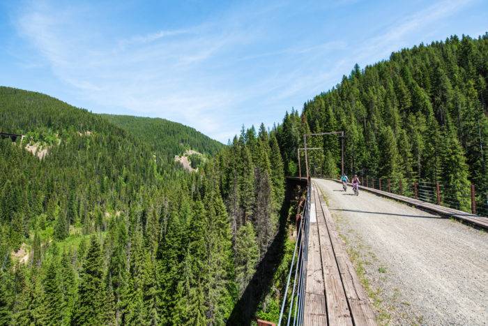 Riding over a trestle bridge on the Route of the Hiawatha