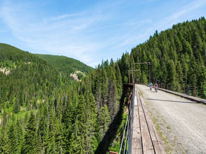 Riding over a trestle bridge on the Route of the Hiawatha. Photo Credit: Idaho Tourism