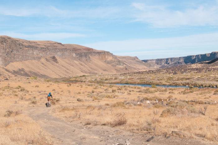 cyclist in desert canyon