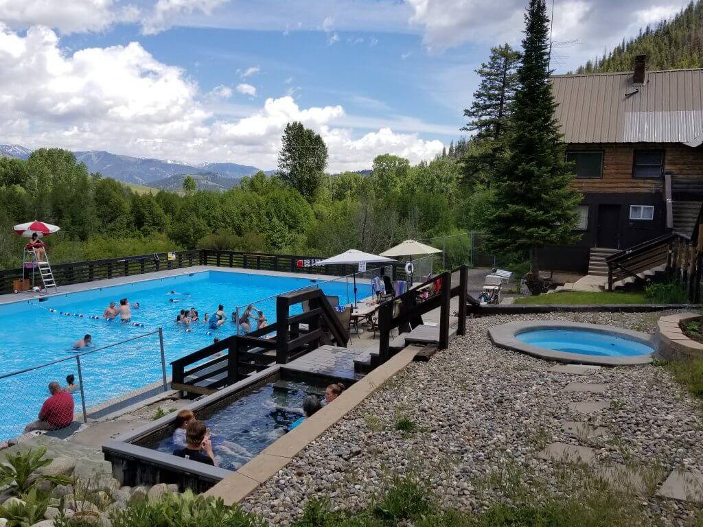 People enjoy several different pools set in a scenic landscape at Easley Hot Springs.