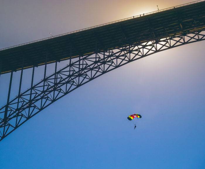 bridge with man on parachute