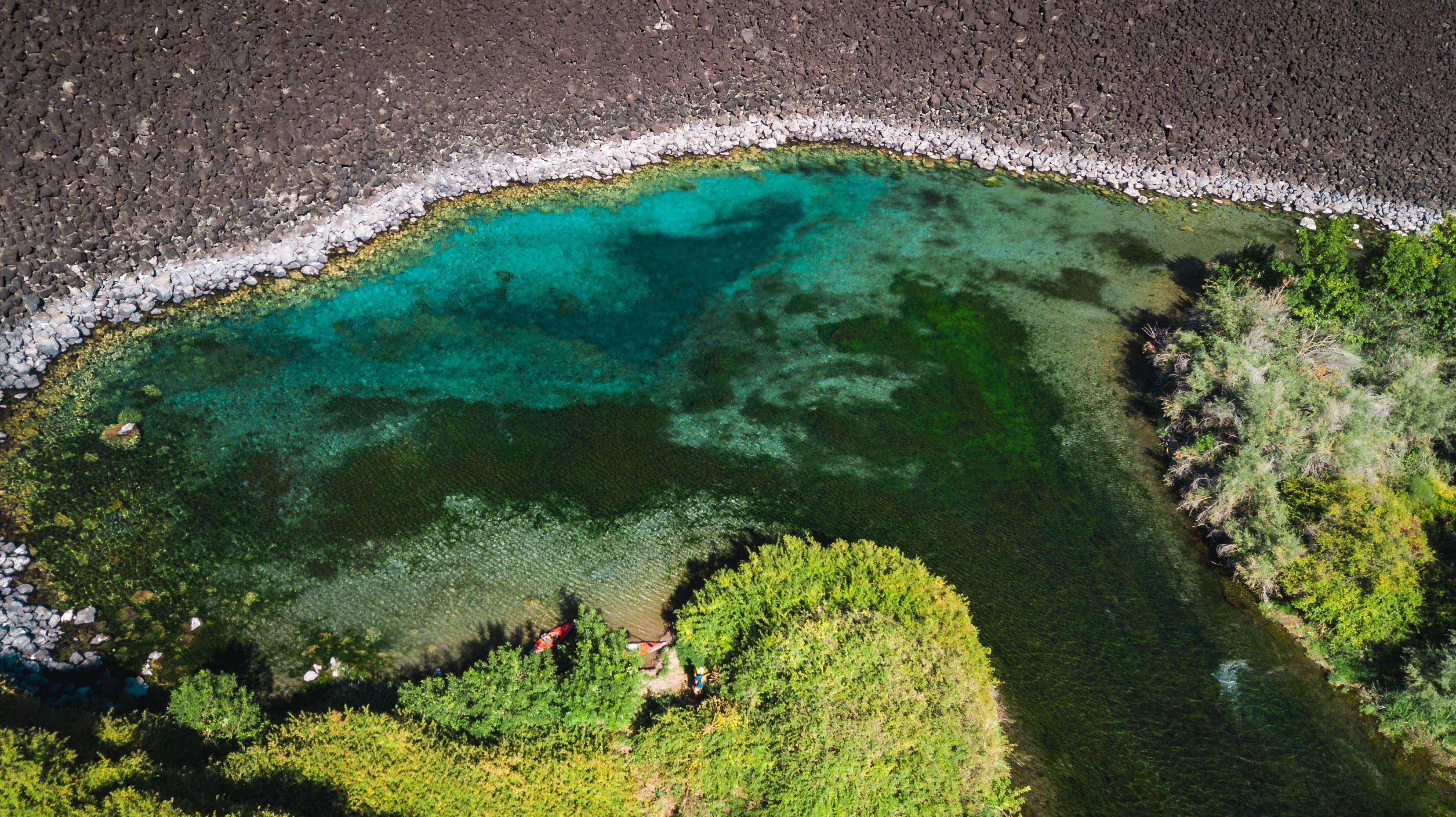 Explore the exotic waters of Blue Heart Springs. Photo Credit: Rolling Van Creative.