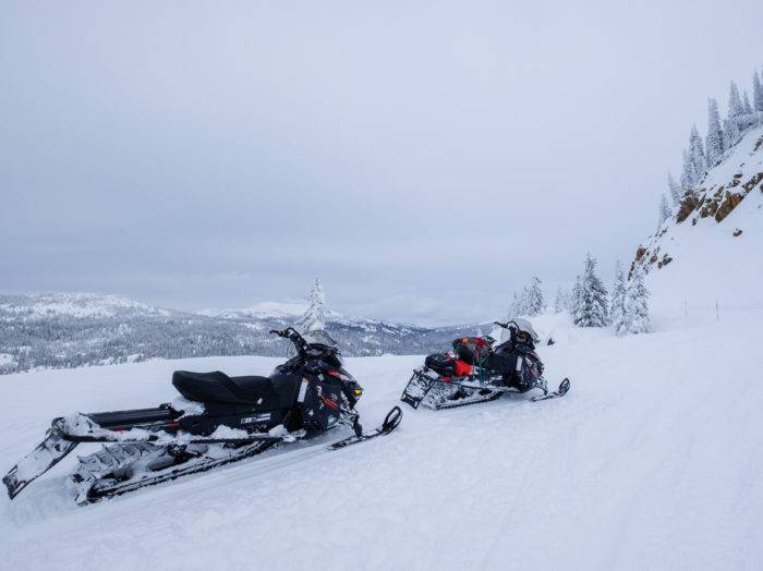 Put a guided snowmobile trip on your list. Photo Credit: Traveling Newlyweds.