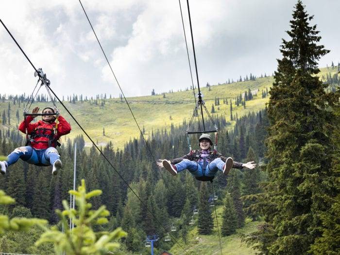 Ziplining is better together at Schweitzer Mountain Resort. Photo Credit: Idaho Tourism.