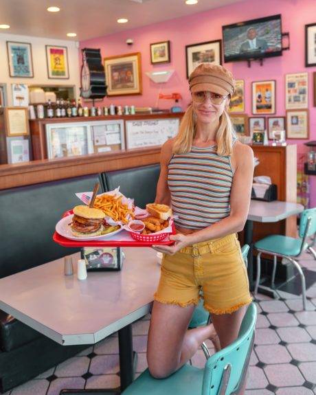 woman holding tray of food