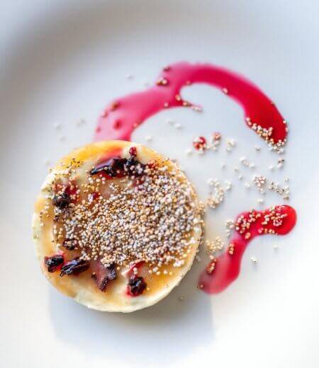 white plate with Lime cream pie, rose hip, hibiscus, caramel, amaranth.