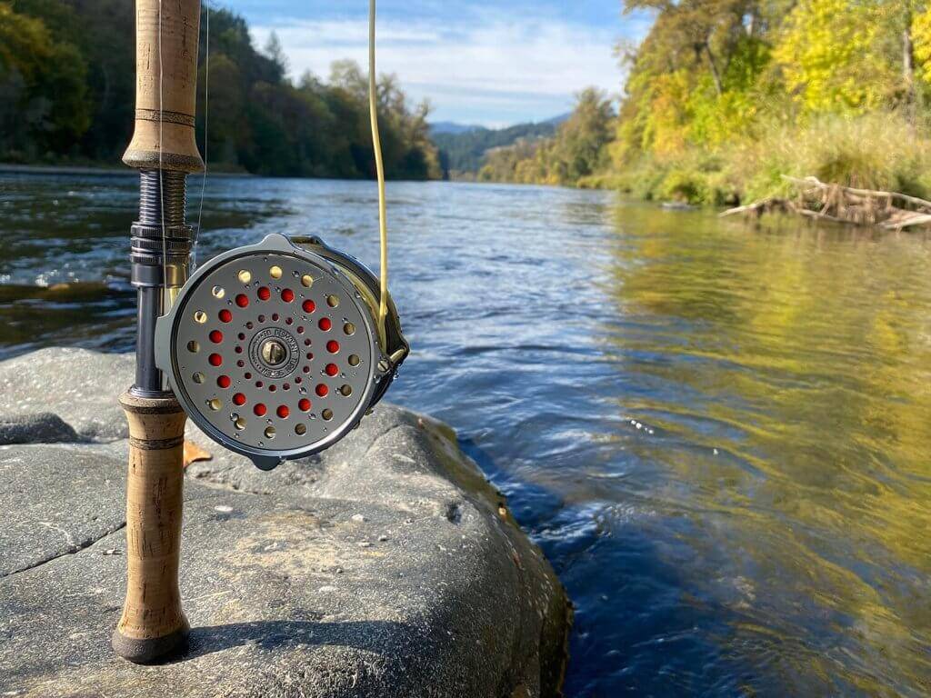 A CF Burkheimer Spey rod with a river in the background.