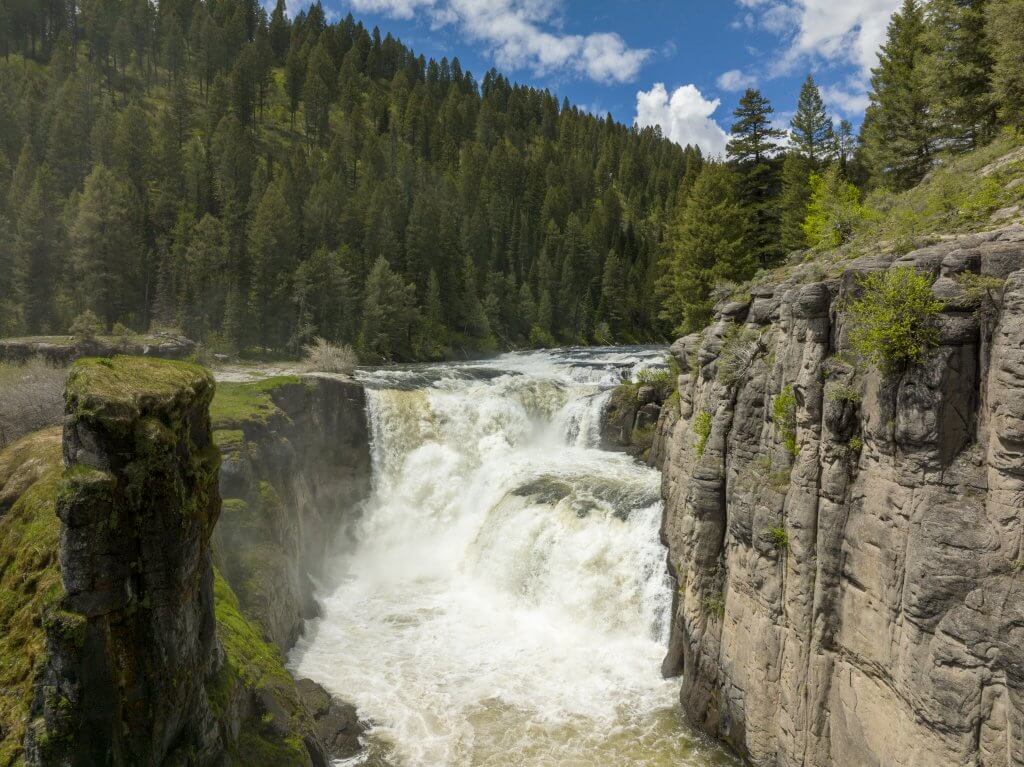 An aerial shot of Lower Mesa Falls during full flow.