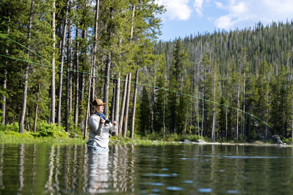 A person throws a fishing line into Wallace Lake.