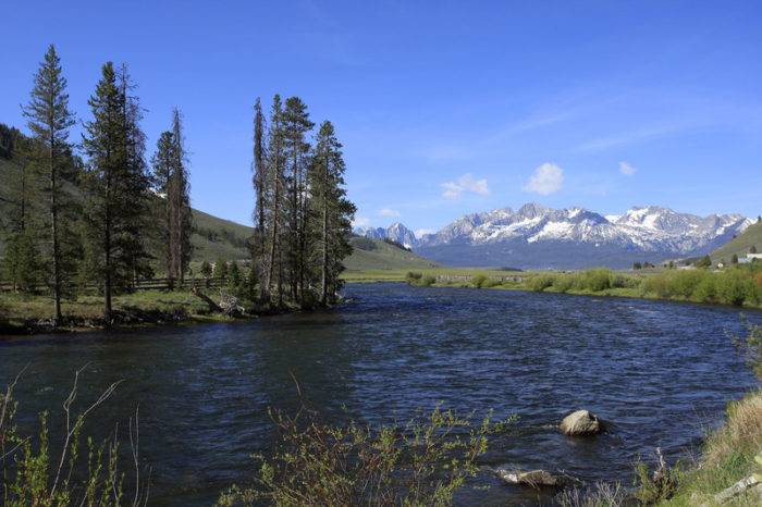 A river with mountain in the background.