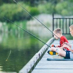 Two kids fishing on a dock at Anderson Ranch Reservoir.