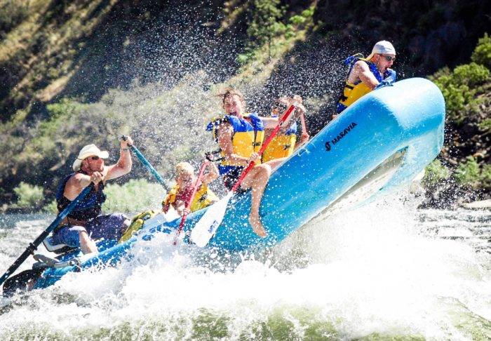 A family rafting on a river.