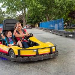 Woman and child on go-kart at Wahooz Family Fun Zone.