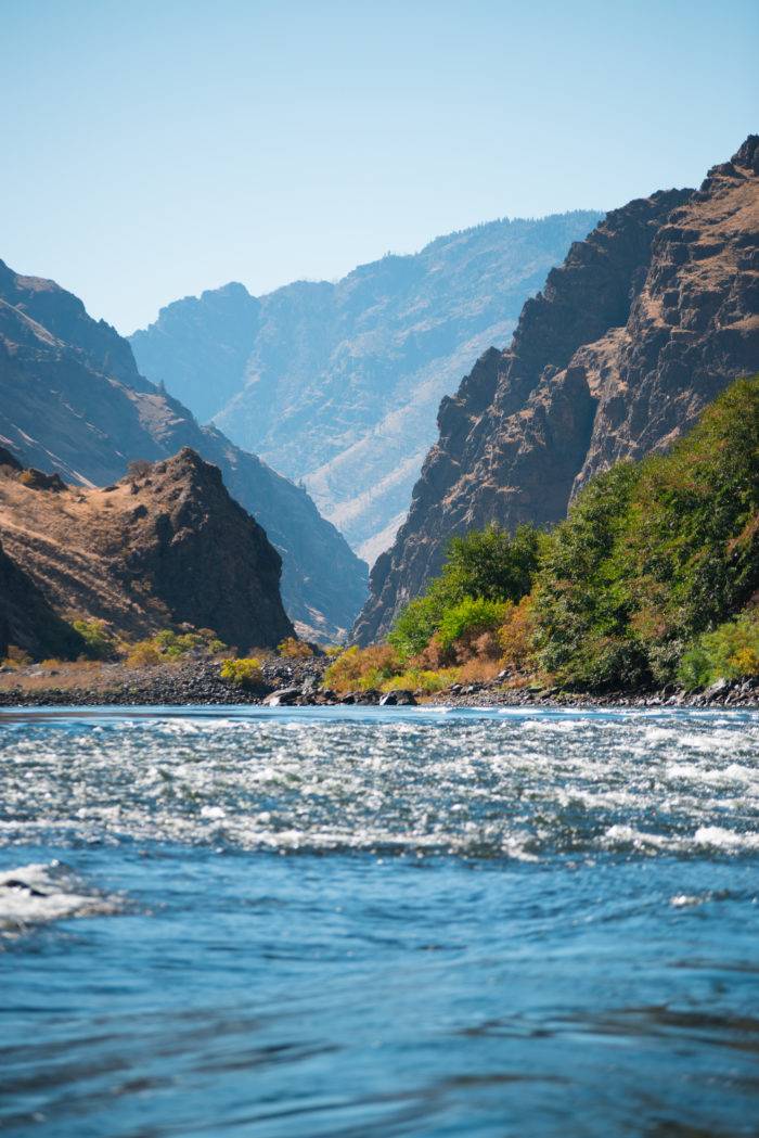 A river flowing between two tall canyon walls.