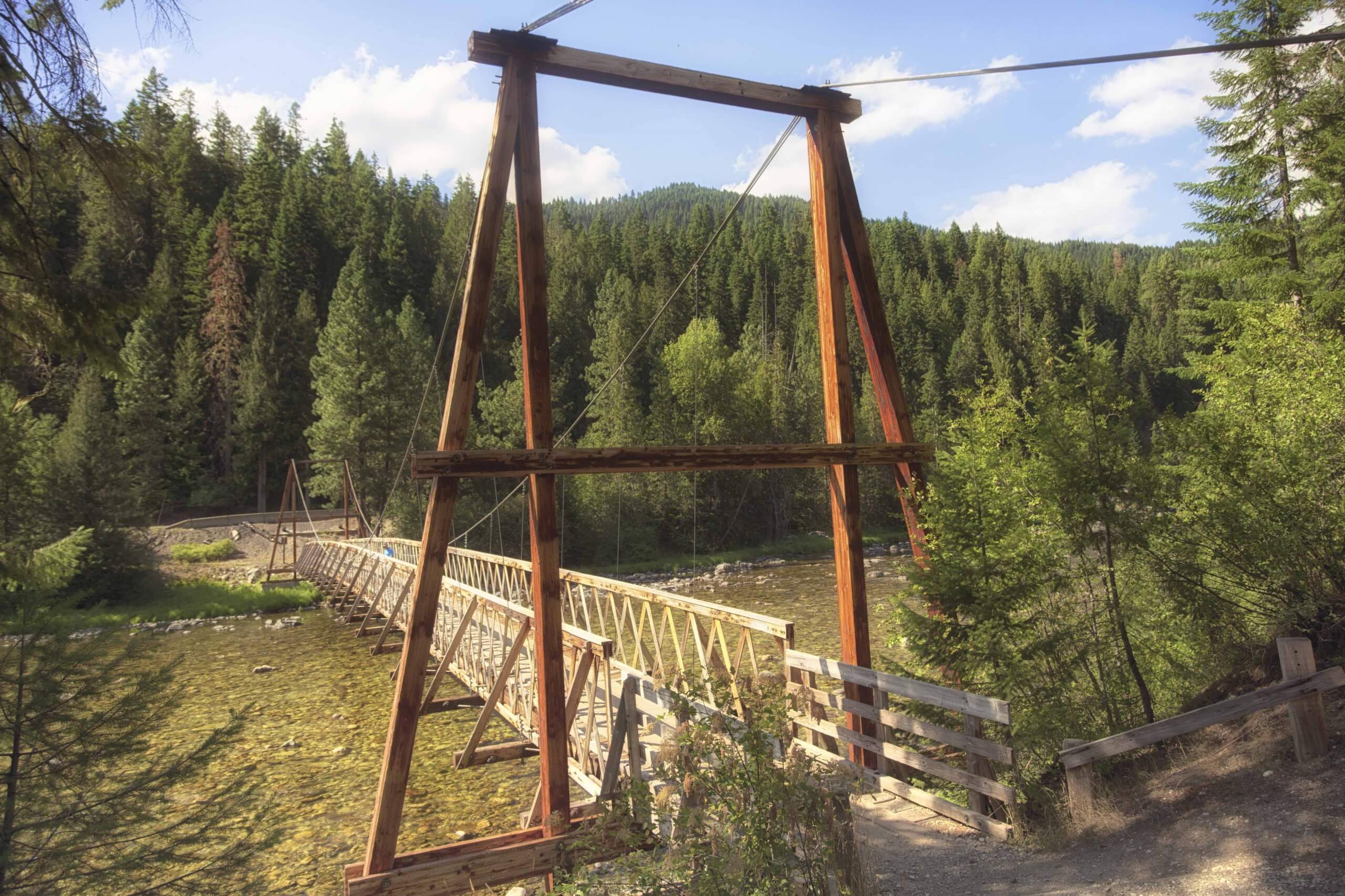 Wooden foot bridge across the river.