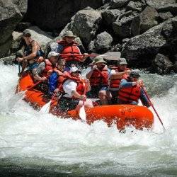 A family whitewater rafting down the South Fork of the Main Payette River.