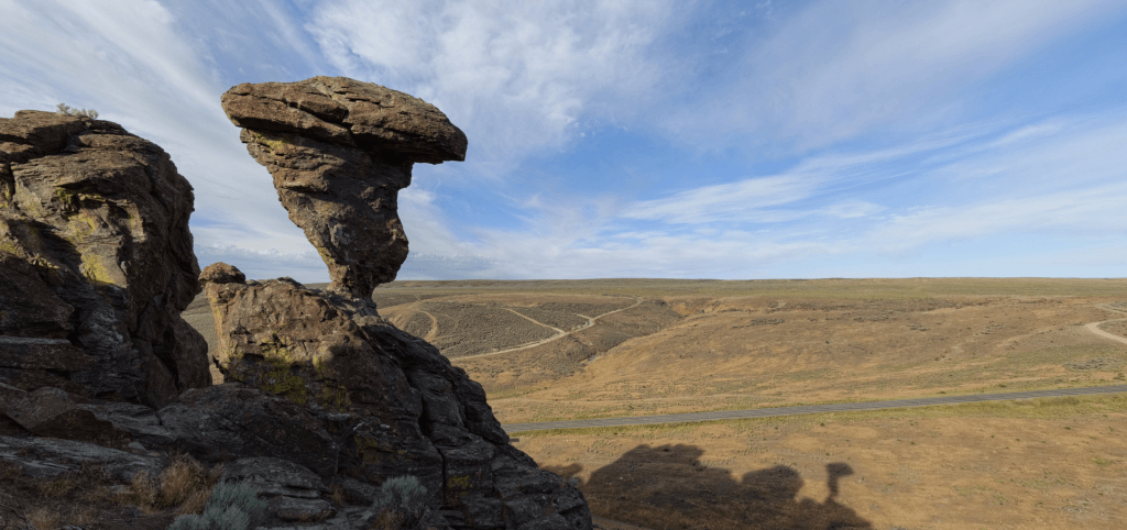 A rock balancing atop another rock.