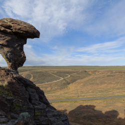 A rock balancing atop another rock.