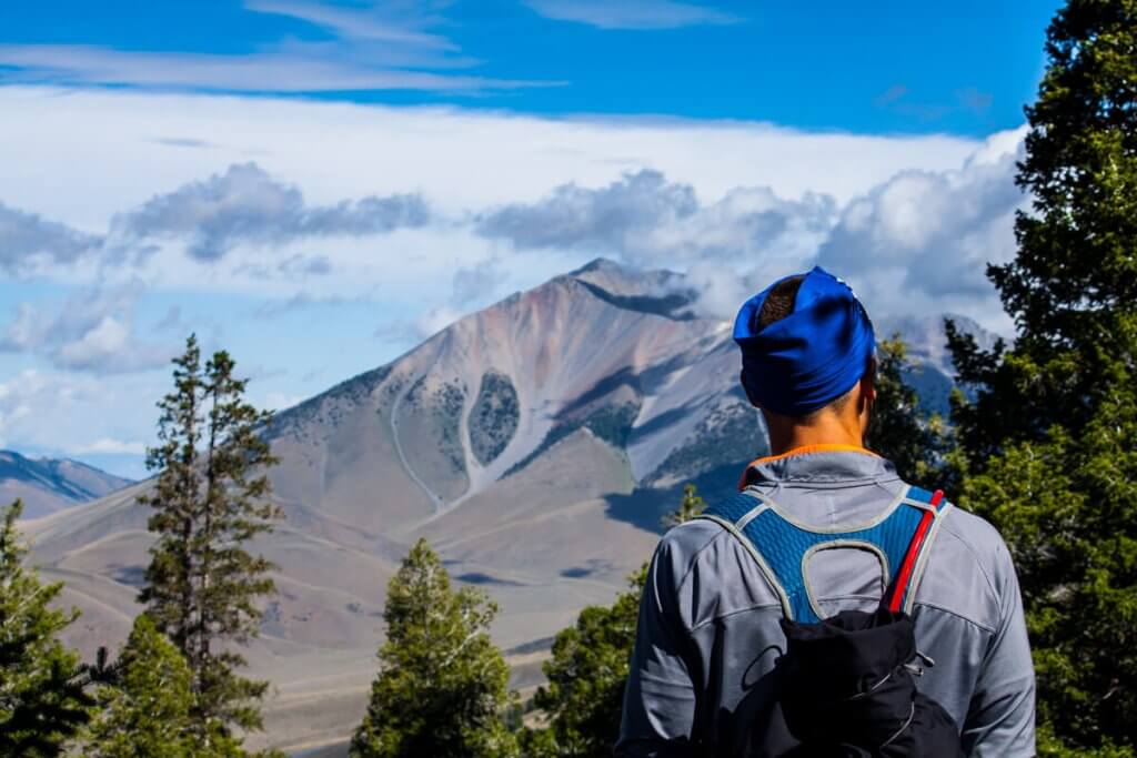 A hiker taking in the views at Mt. Borah.