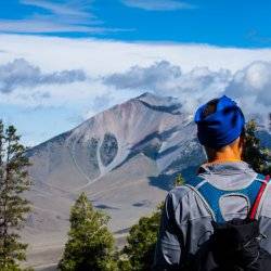 A hiker taking in the views at Mount Borah.