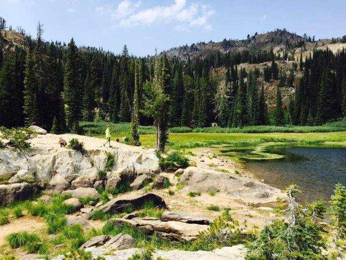 A scenic view of a lake on top of a mountain.