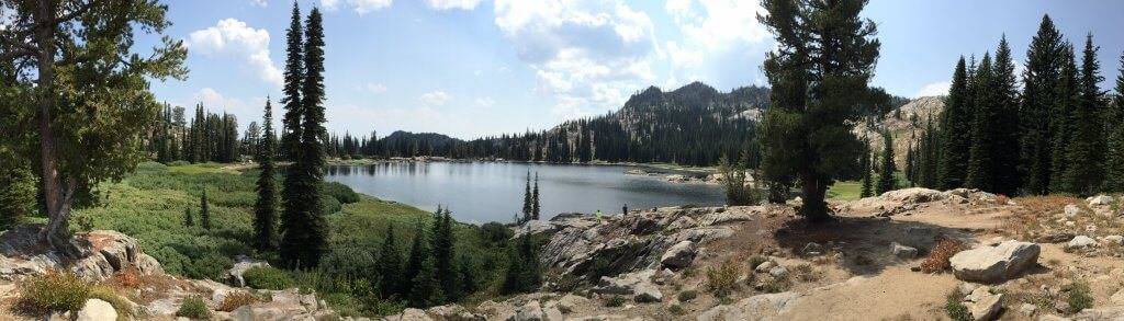 A panorama of a lake on top of a mountain.