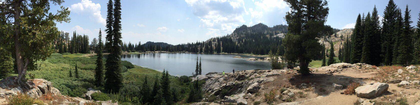 A panorama of a lake on top of a mountain.