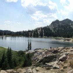 A panorama of a lake on top of a mountain.