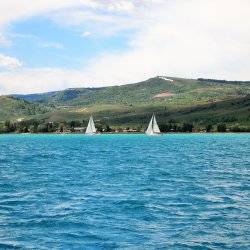 Two sailboats on a lake Bear Lake Idaho.