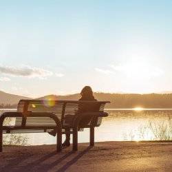 Woman on bench at Coeur d'Alene Parkway State Park