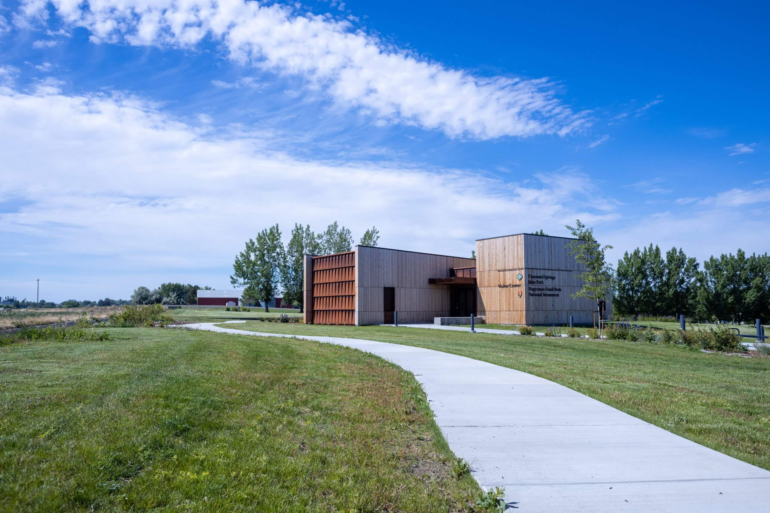 The exterior of a modern-looking visitor center for Thousand Springs State Park and Hagerman Fossil Beds.