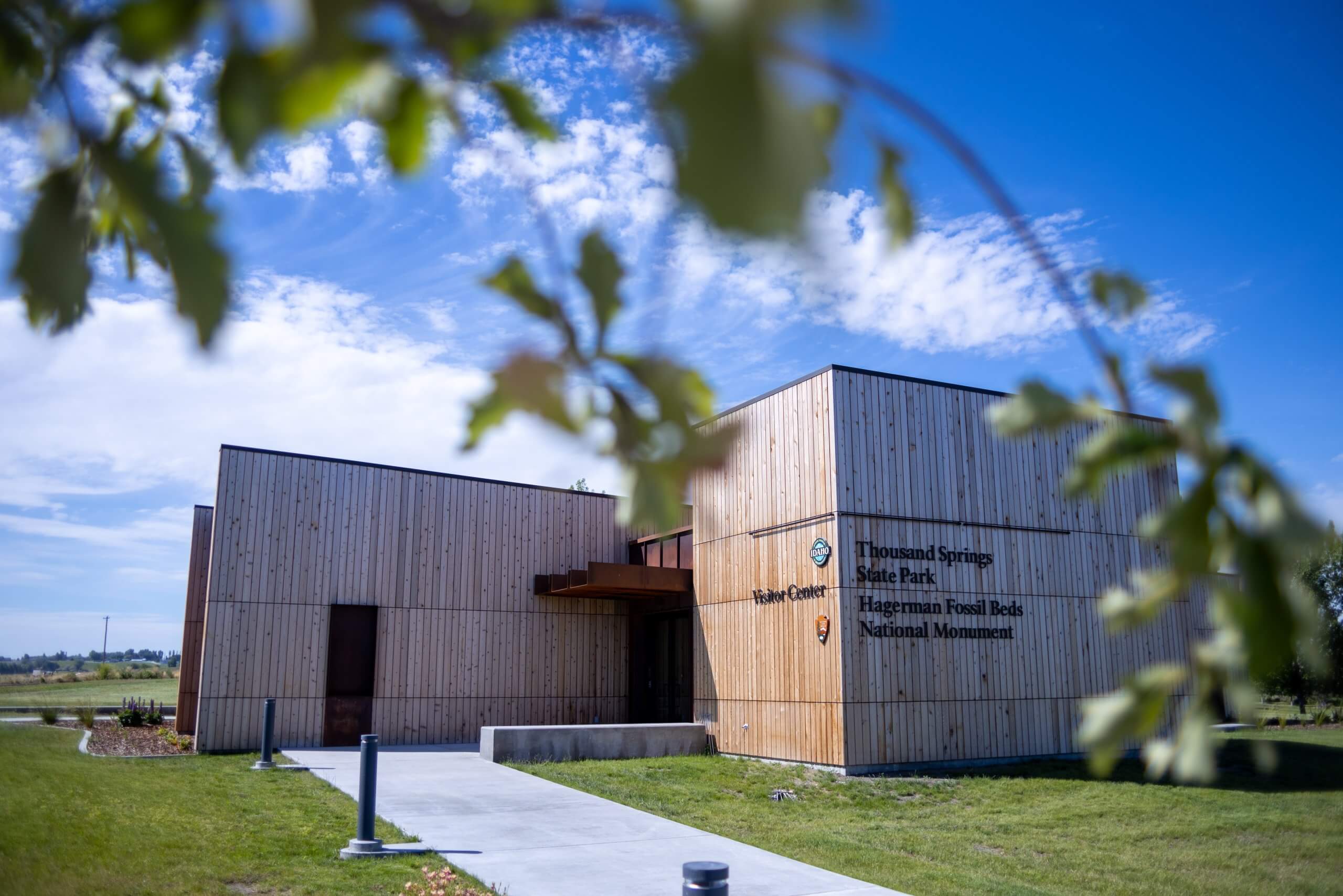 The modern exterior of the Thousand Springs and Hagerman Fossil Beds Visitor Center in spring.