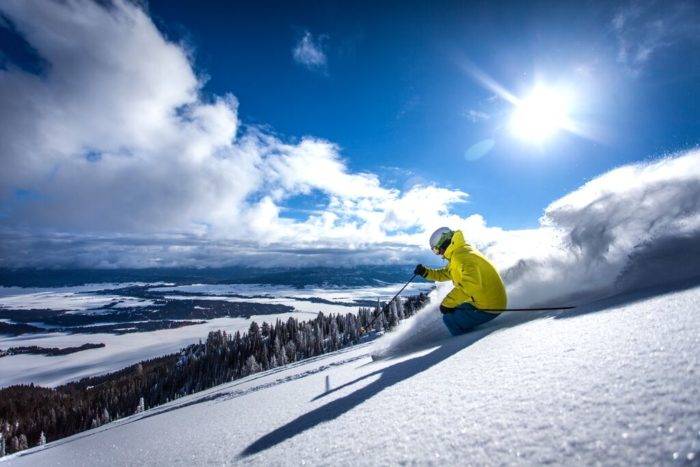 A skier headed down a ski run.