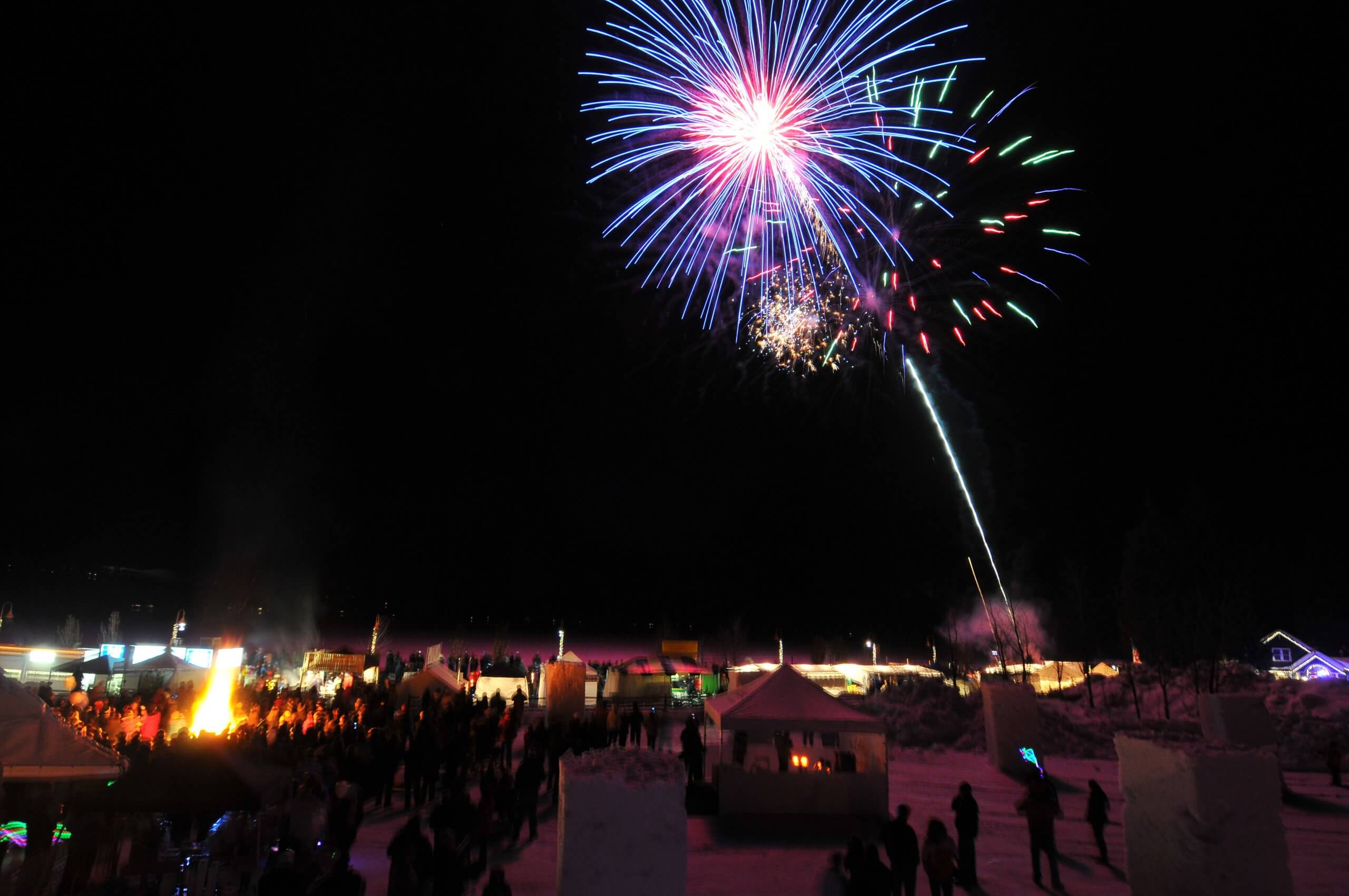 Fireworks over a carnival.