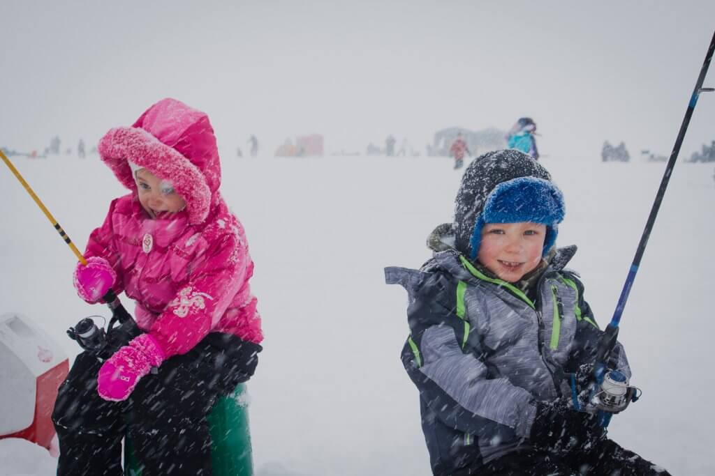 A family hoping to catch some Perch at the Idaho Youth Outdoors: 7th Annual Youth Ice Fishing Day.