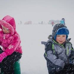 A family hoping to catch some Perch at the Idaho Youth Outdoors: 7th Annual Youth Ice Fishing Day.