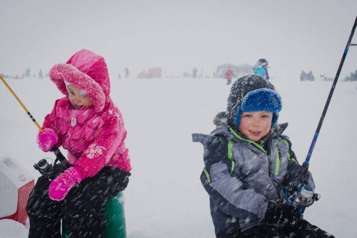 A family hoping to catch some Perch at the Idaho Youth Outdoors: 7th Annual Youth Ice Fishing Day.