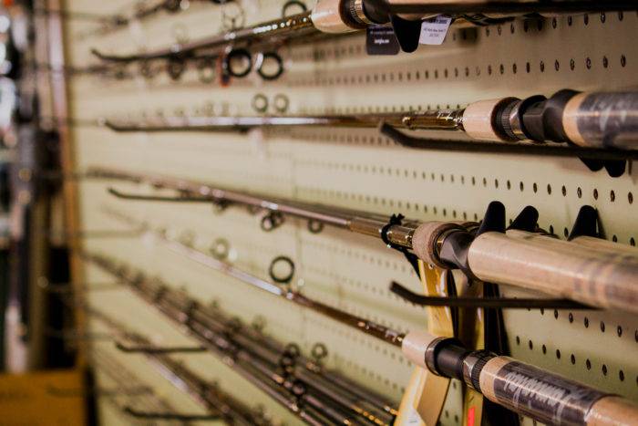 Fishing rods on the wall inside of Tackle Tom’s.