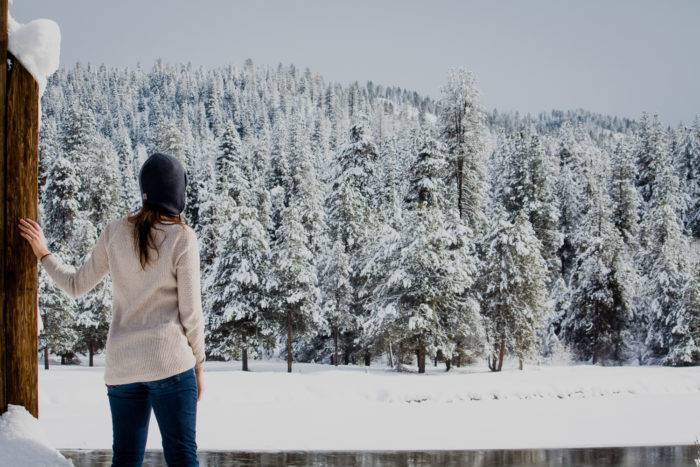 A girl looking out over a winter landscape.