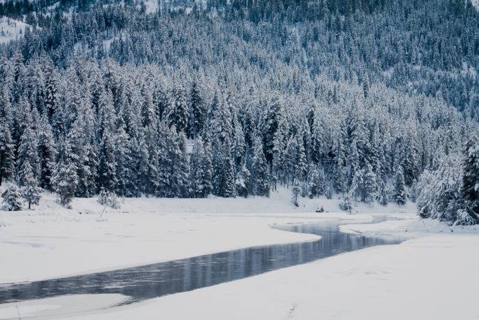 A river winding through a snowy valley.