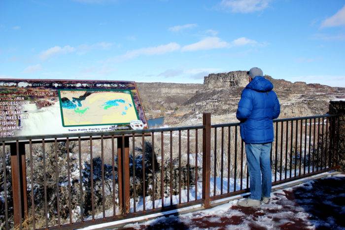 Man looking out into Shoshone Falls