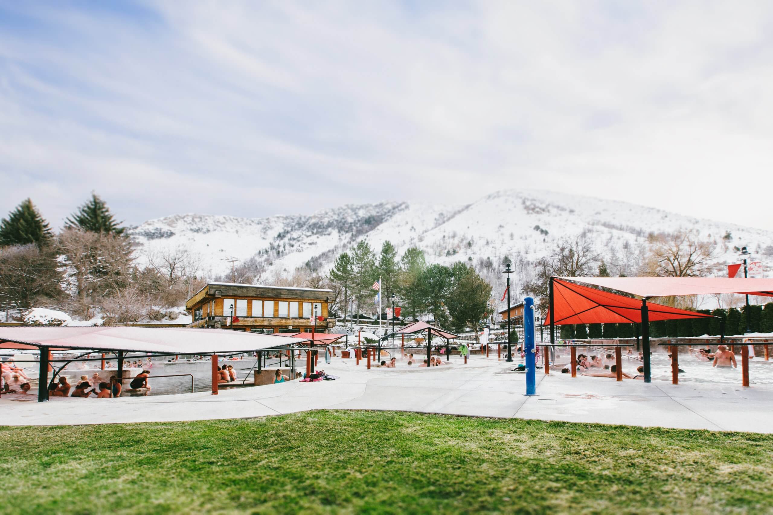 A picture of a hot springs in the winter.