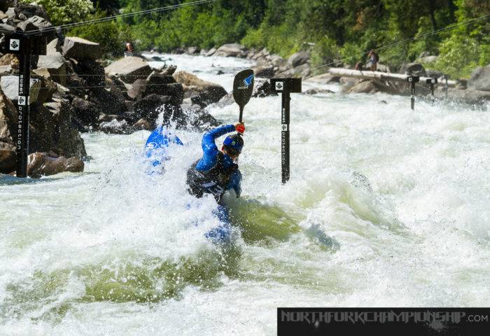 Kayaker on big whitewater.