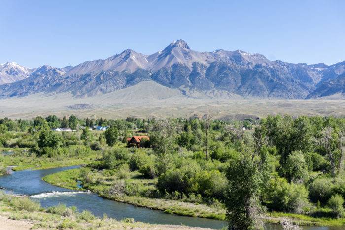 Green valley with mountains in the background