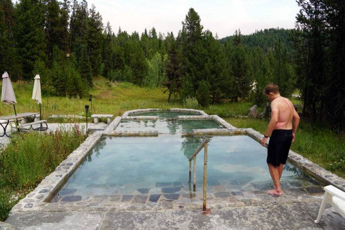 man walking into hot pools