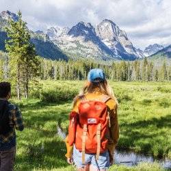 A group of friends hiking along Fishhook Creek Trail near Redfish Lake.