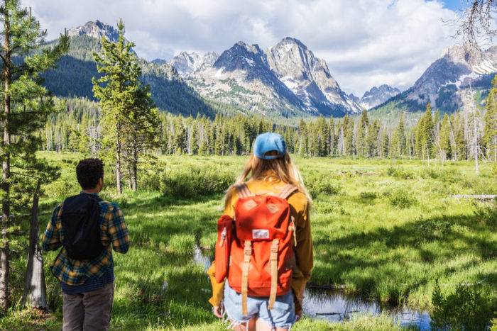 A group of friends hiking along Fishhook Creek Trail near Redfish Lake.