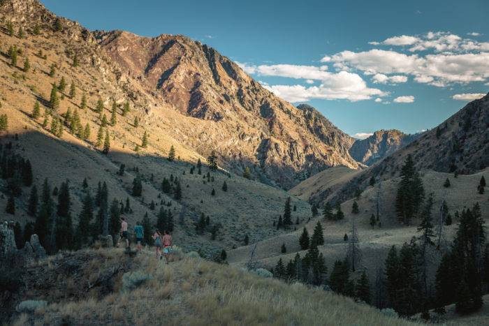 hikers on a mountain along side the Salmon River