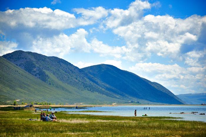 A family swimming in the cool waters of Bear Lake. 