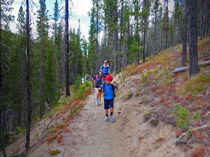 family hiking on a mountain trail